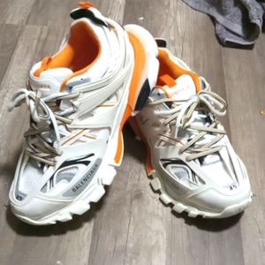 Balenciaga track shoes white with blue orange stripes.